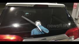Knife waving serial killer WiperTag decal accessory on a rear wiper