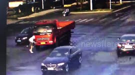 Chinese cyclist miraculously avoids being run over by truck