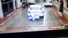 Miraculous moment boy emerges unhurt after coming under wheels of moving SUV in western India