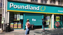 Poundland customers crawl into UK shop after shutter jams