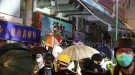Hong Kong Anti Extradition Protest. Protesters remove signs from a restaurant they believe to be owned by triads responsible for attacks