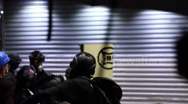Hong Kong Anti Extradition Protesters attack and smash a doorway of a Mahjong parlour they believed to be owned by triads
