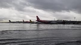 Planes stranded in knee-deep water after Tropical Storm Bailu floods airport