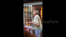 It runs in the family! Great-grandmother and 5-year-old boy demonstrate incredible beer pong precision