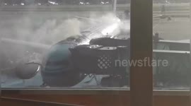 Passengers evacuated as smoke billows from plane at Beijing Capital International Airport