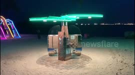 Singapore beach displays brightly coloured solar-powered sunscreen dispensers