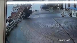 Shocking moment dump truck in India topples over into ocean