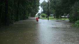 Truck driving through flood