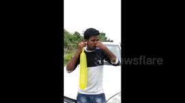 Indian man inflates 80cm balloon with his ear in bizarre feat