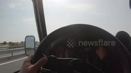 a  car driving on the motorway from the point of view of the driver