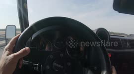 a  car driving on the motorway from the point of view of the driver