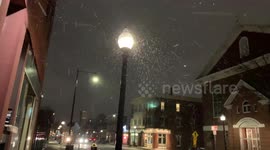 Waking in a street in a snowy night
