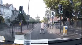 'Awww bless him': UK driver waits at green light while elderly man crosses in bizarre manner
