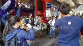 Extinction Rebellion samba band in city market street