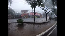 Filipino kids play in flood water one the roads