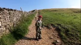 Adorable 'plane mad' five year old has donned a flight suit and climbed a SIX-MILE mountain to raise money for injured pilots