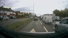 Passenger jumps out of van while stuck in London traffic and takes something from roadside house