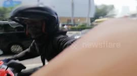 Motorbike driver nearly bumped into the children and attacked pedestrians on the sidewalk