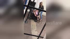 Newsflare Edit - Horrifying moment London woman caught strangling young daughter in stroller