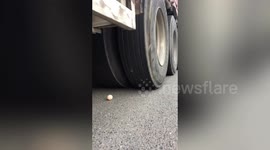 Chinese trucker delicately manoeuvres OVER AN EGG without breaking it