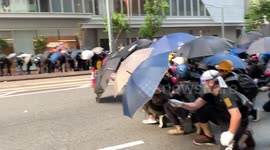 Hong Kong protesters advance on police lines in Wan Chai