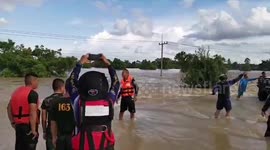 Bungling motorist has to be rescued after trying to drive through flooded road