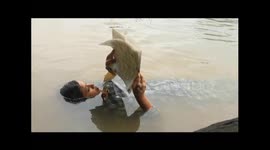 Teenage girl lives 'mermaid-like' existence in India reading, sleeping and eating in water