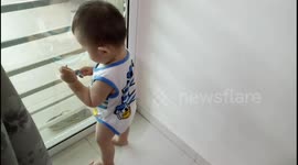 Funny Baby Tries To Open Door Using Keys