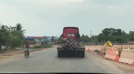 Truck Over-Loaded With Metal Poles In Cambodia