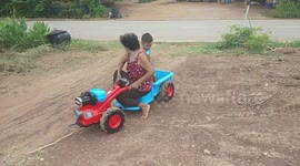 Granmother Rides On Boy's Toy Truck