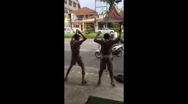 Thai policeman orders schoolboys to do star jumps after catching them riding without helmets