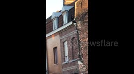 Onlookers in French town stunned by panther poised on roof of building