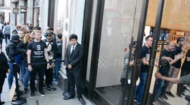 Eager fans rush into Apple store in London as new iPhone is released