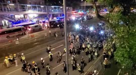 Hong Kong Riot Police move in numbers on a main road in Yuen Long after a sit in at a nearby shopping mall by Hong Kong pro democracy protesters