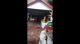 Flash floods gush through Buddhist temple after heavy rain in Thailand