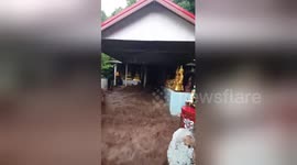 Flash floods gush through Buddhist temple after heavy rain in Thailand