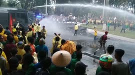Thousands of students face water cannons and riot police when protesting against Indonesian government