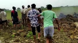 People flock to see remains of crashed army aircraft in central India
