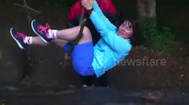 Funny lady  stuck on swing