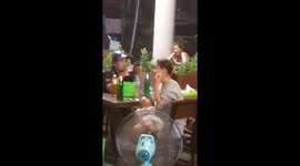 Woman Rocks Baby To Sleep While Partying