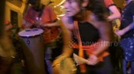 Drumming group play in the streets at the gracia festival in barcelona