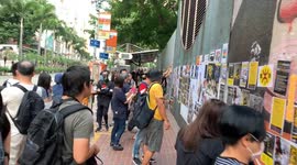 Students protest near Wanchai Southorn playground creating a giant Lennon Wall
