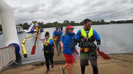 Team coming off boat after participating in The Lord Mayor's Dragon Boat Race