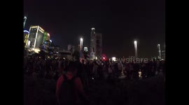 A protester carries an American flag during the rally at Tamar Park, on 28 September 2019