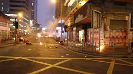 Hong Kong police fire multiple rounds of tear gas as protesters respond with Molotov cocktails and petrol bombs