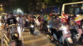 Hanoi’s Mad traffic by train station.