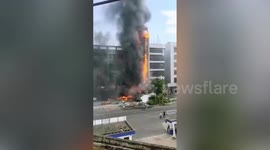 Five-storey building bursts into flames after out-of-control truck crashes into it in China