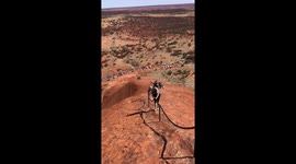 Locals outraged as thousands flock to Uluru for final chance to scale sacred rock before climbing ban is enforced