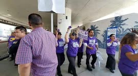Rideshare drivers and union workers march at Los Angeles airport block traffic to demand better rights