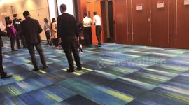 Pro-migrant protesters are quickly escorted from Amazon event in Toronto